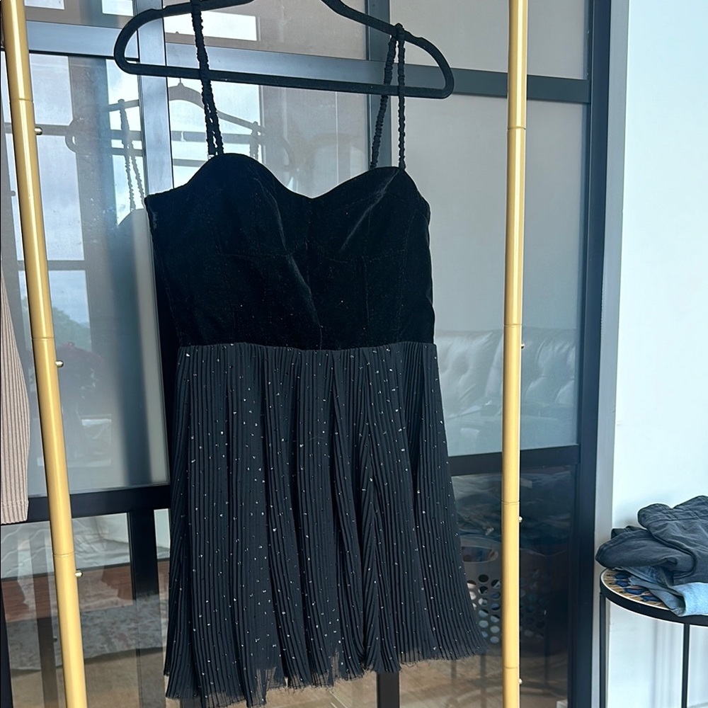 Elegant Black Dress with Pleated Skirt